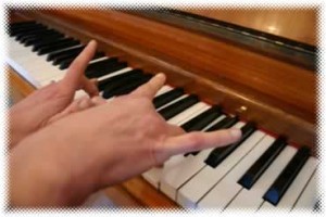 fingers flying off piano notes